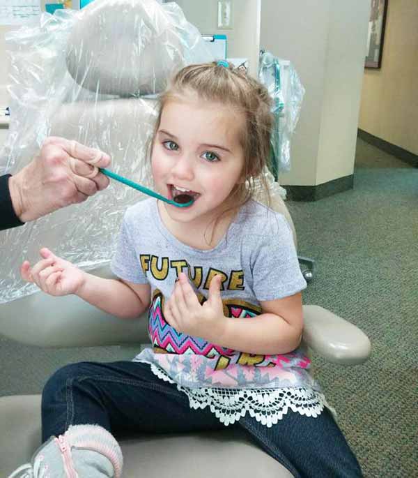 Child in chair: Suchman & Darnall Family Dentistry|Independence, MO 
